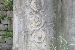 Detail of a decorative element at the Via dei Capitelli gate.