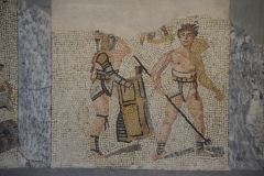 Detail of the gladiator mosaic in the Museo Archeologico al Teatro Romano. A secutor and retarius do battle.