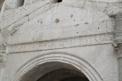Inscription above one of the portals of the Porta Leoni.