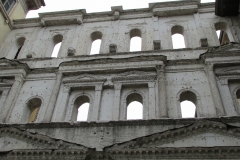 Upper registers of the exterior facade of the Porta Borsari.