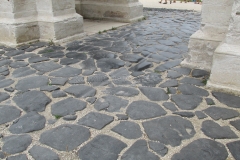 Paving stones running beneath the Arco di Gavi.