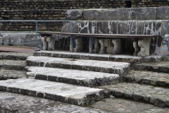 Marble seating immediately above the orchestra of the theater.