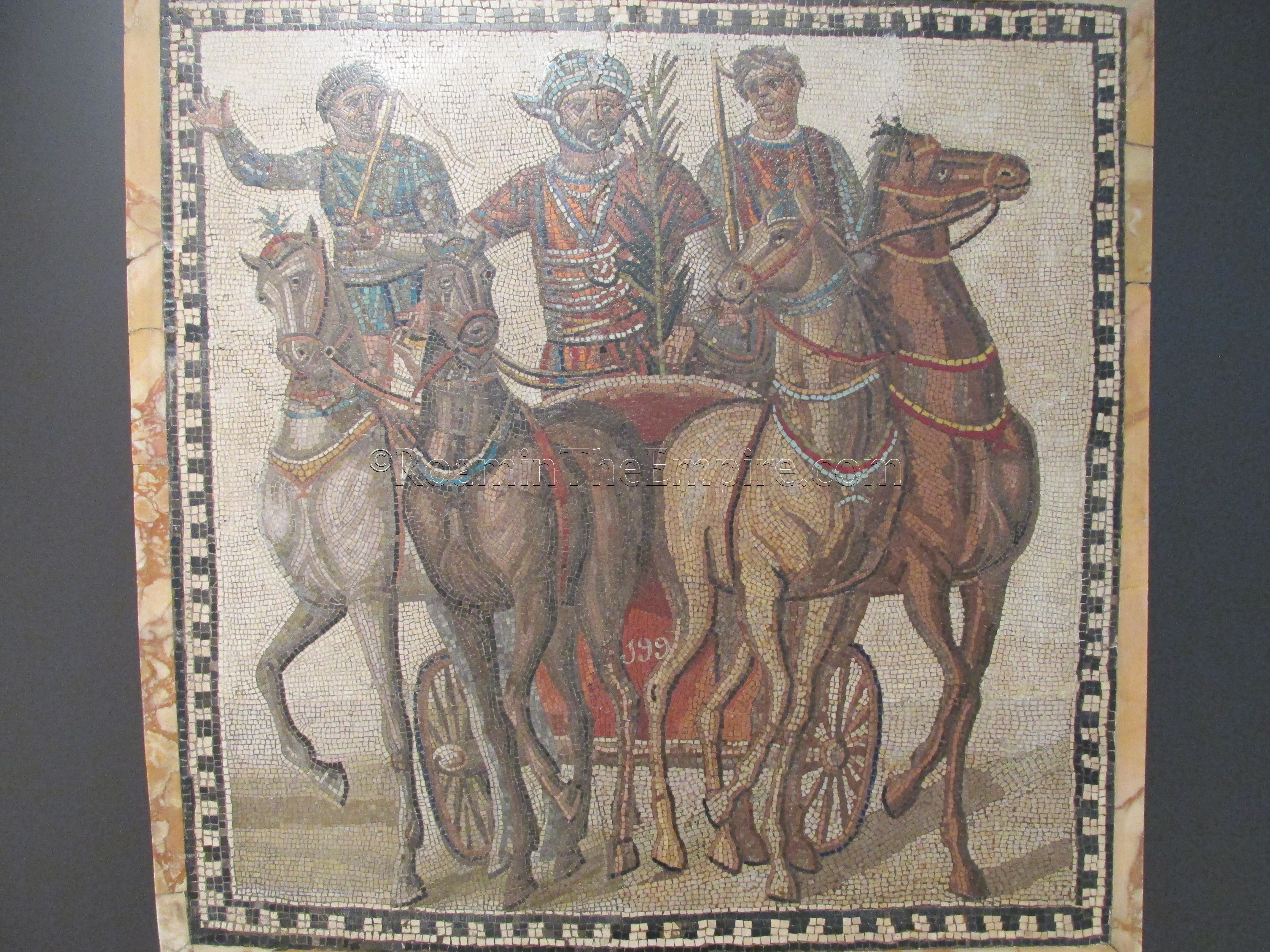Mosaic depicting a quadriga and victorious charioteer of the factio russata. Dated to the 3rd century CE, from Rome. Madrid.