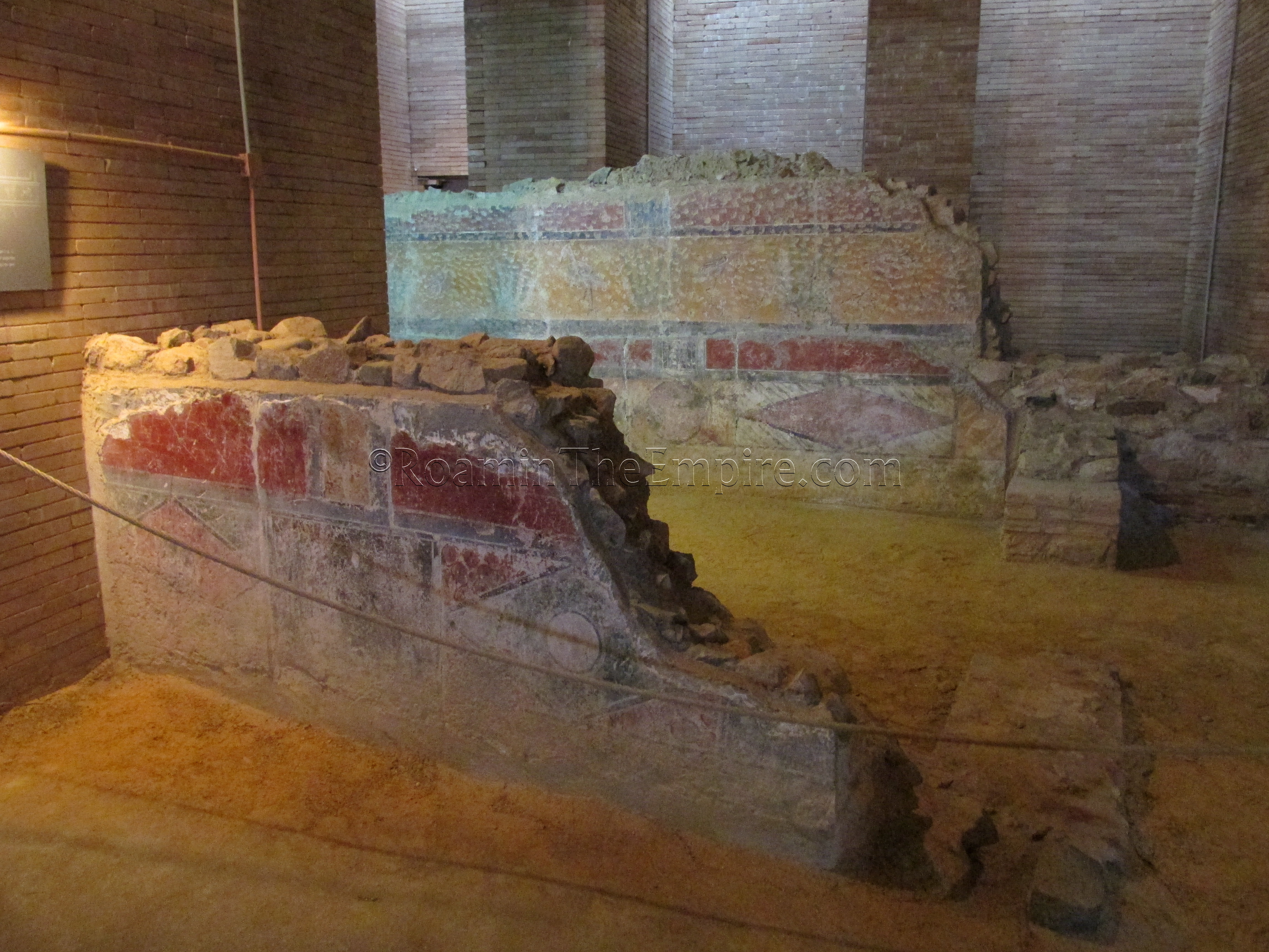 Painted walls from the 1st-3rd century CE domestic structure in the archaeological crypt.