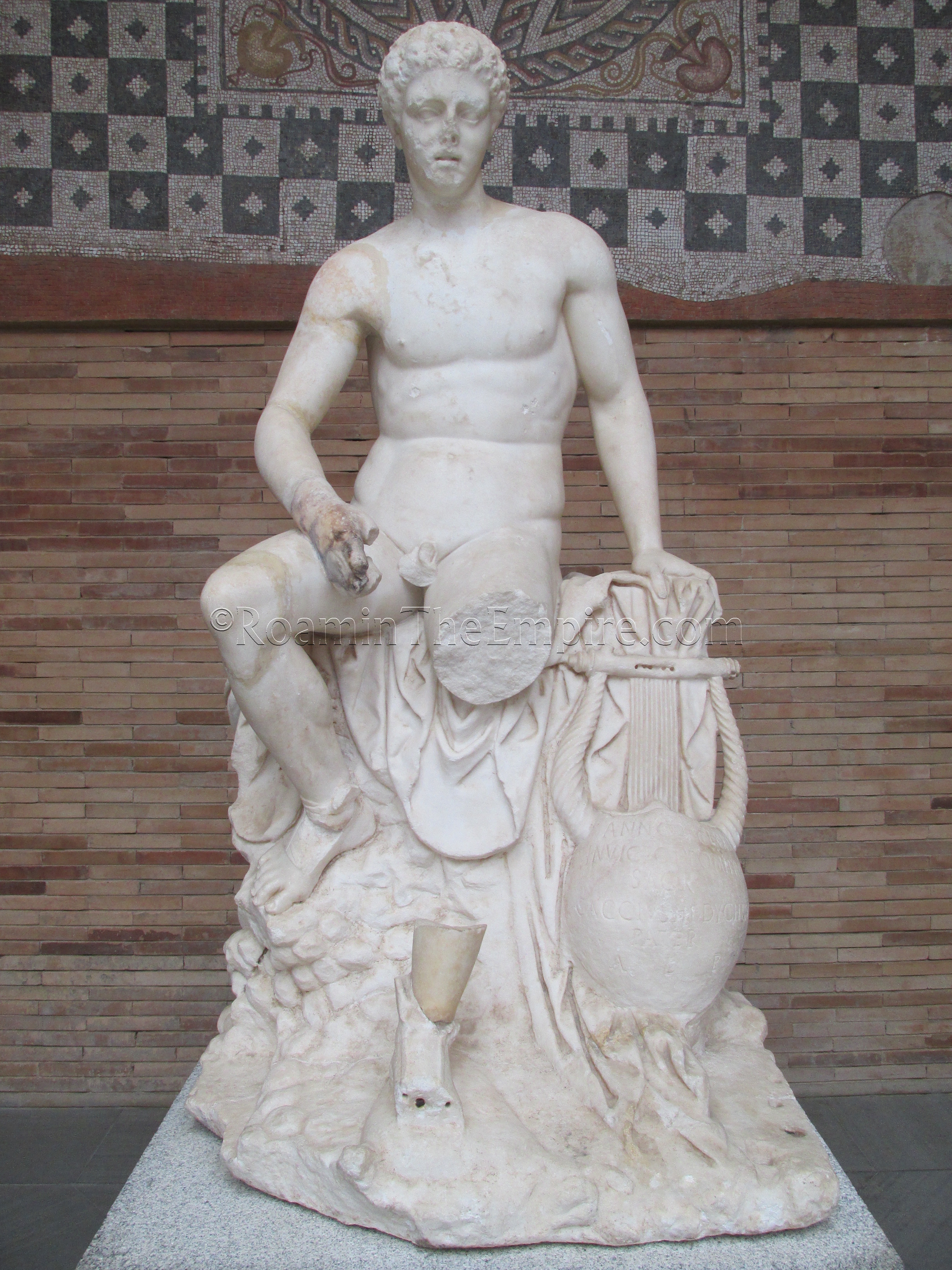 Statue of a seated Mercury with inscribed lyre (see gallery) from the mithraeum. Second century CE.