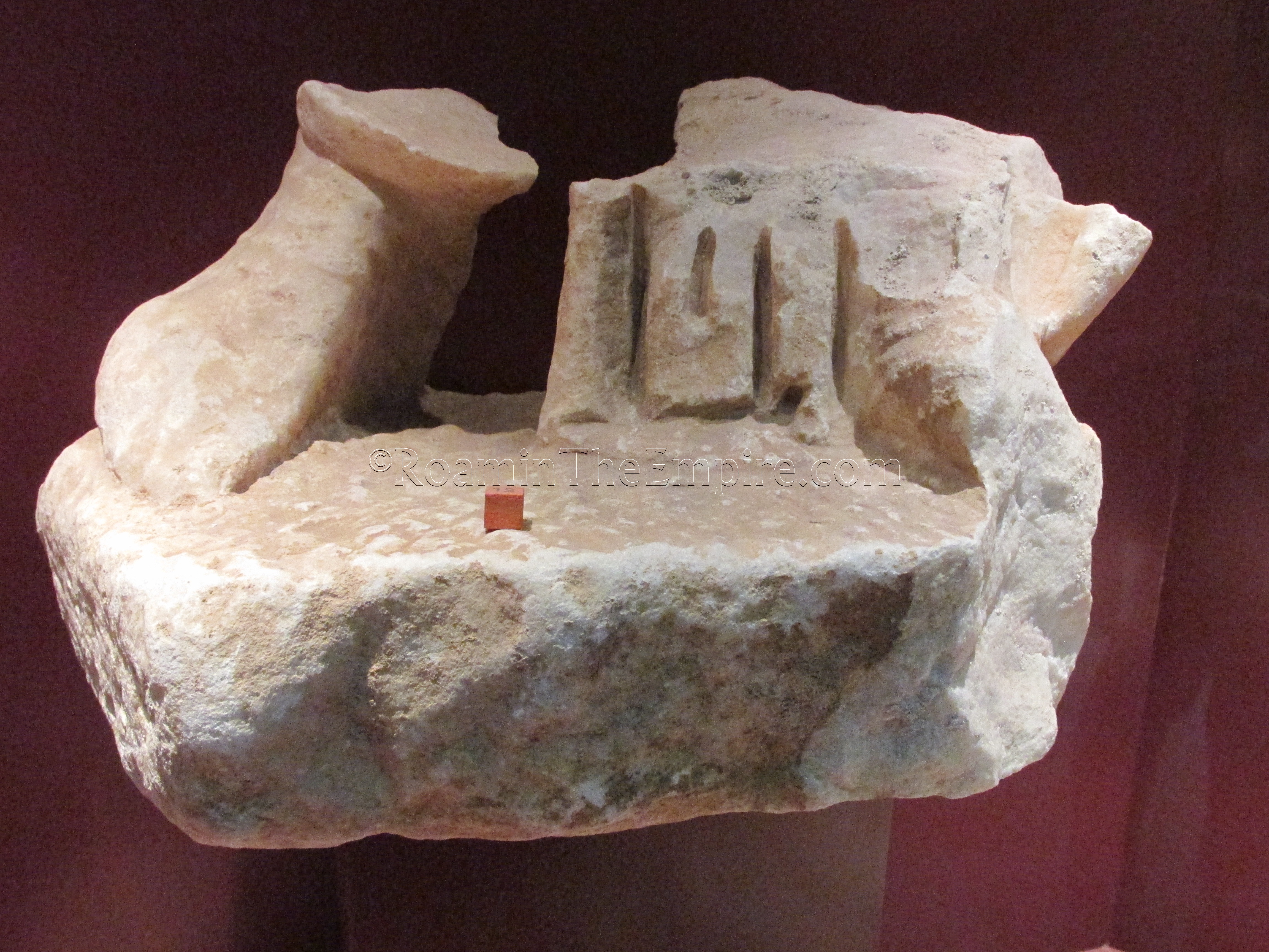 Base of a statuette found and displayed in the interpretive center of the archaeological crypt of the Basílica de Santa Eulalia.