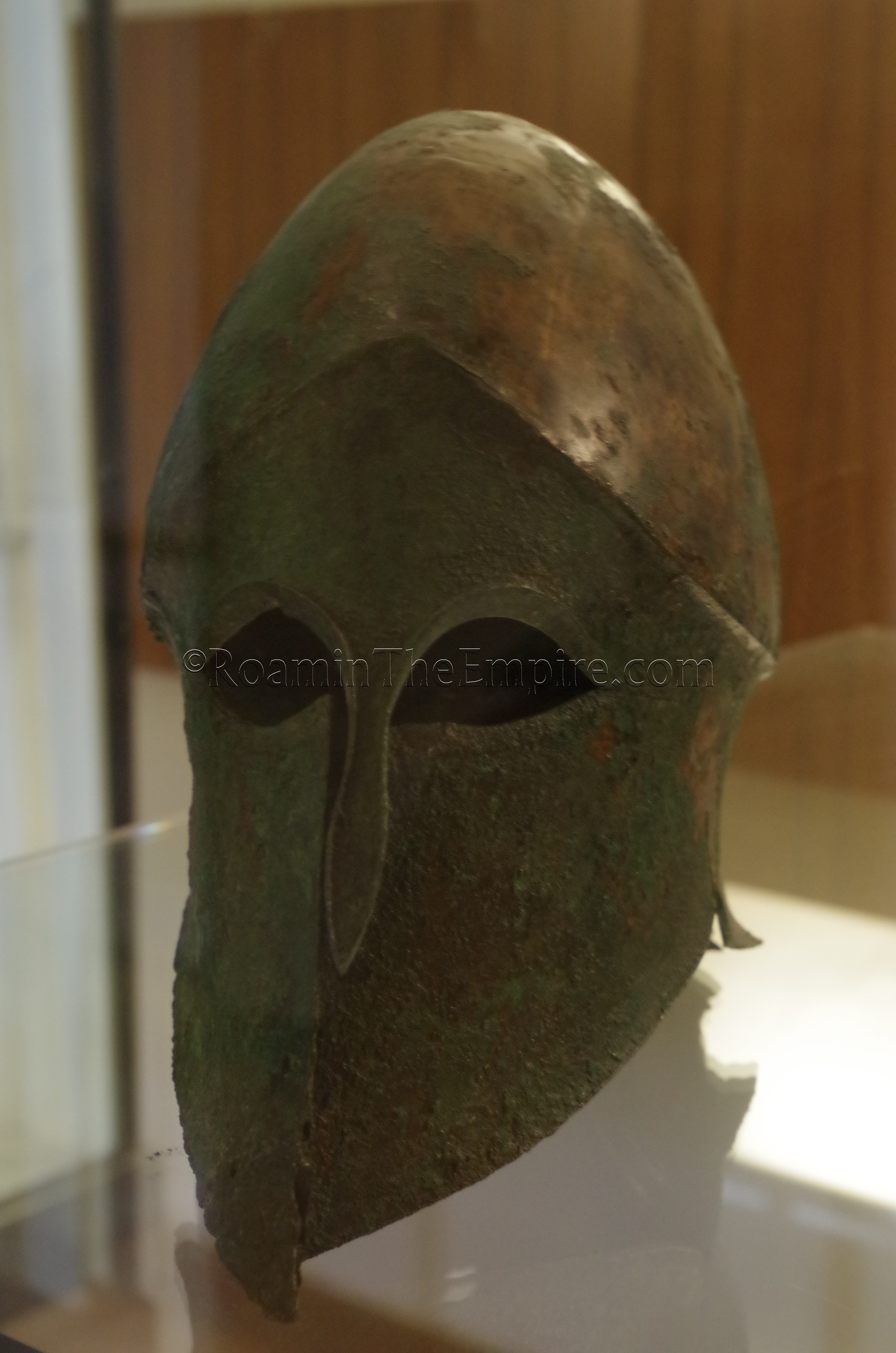 Corinthian helmet from the Montagna di Marzo necropolis, displayed in the archaeological museum.