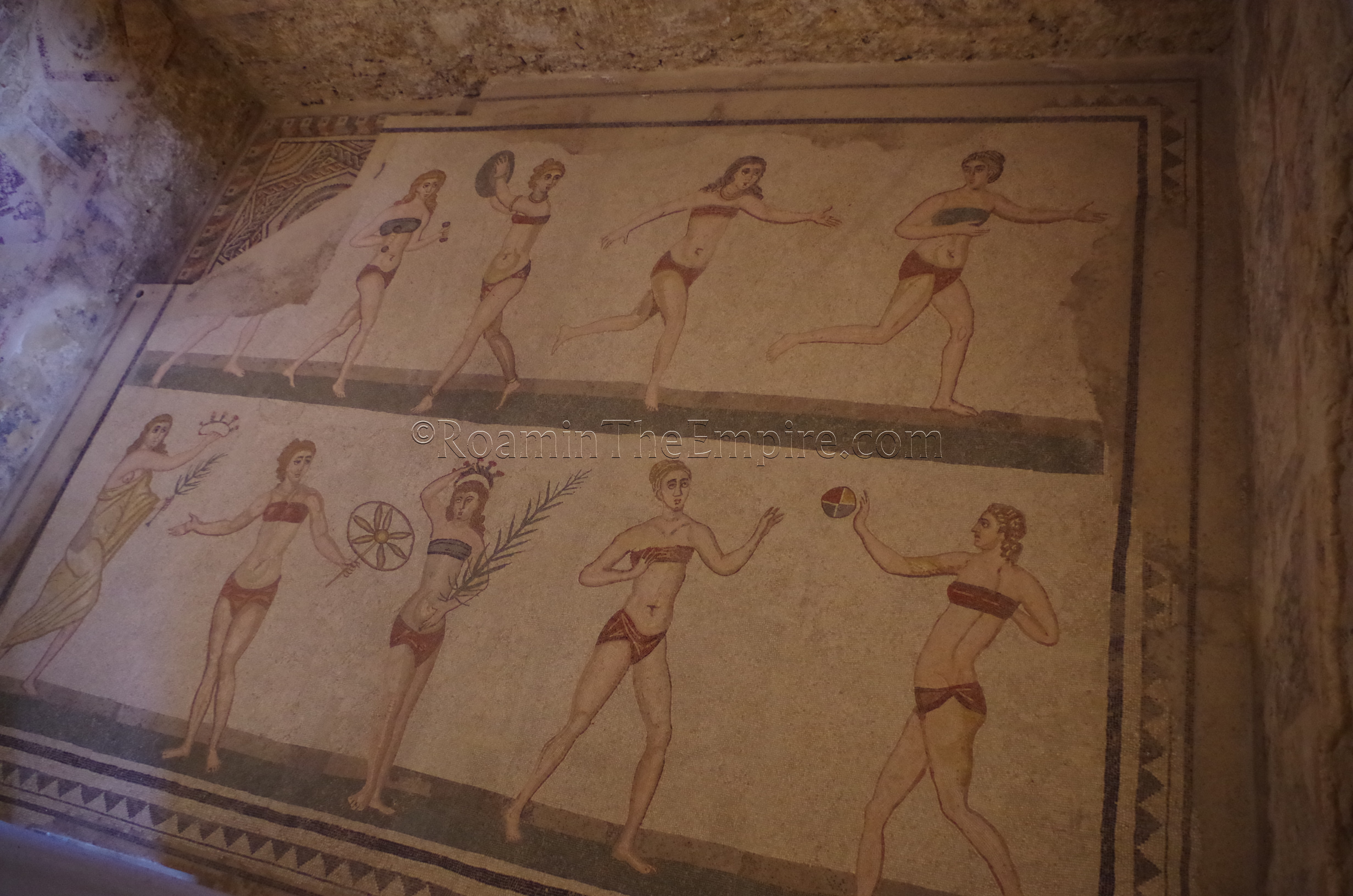 The famous 'Bikini Girls' mosaic in a cubiculum, more formally known as the 'Coronation of the Winner' in the 'Chamber of the Ten Maidens'. Villa Romana del Casale.