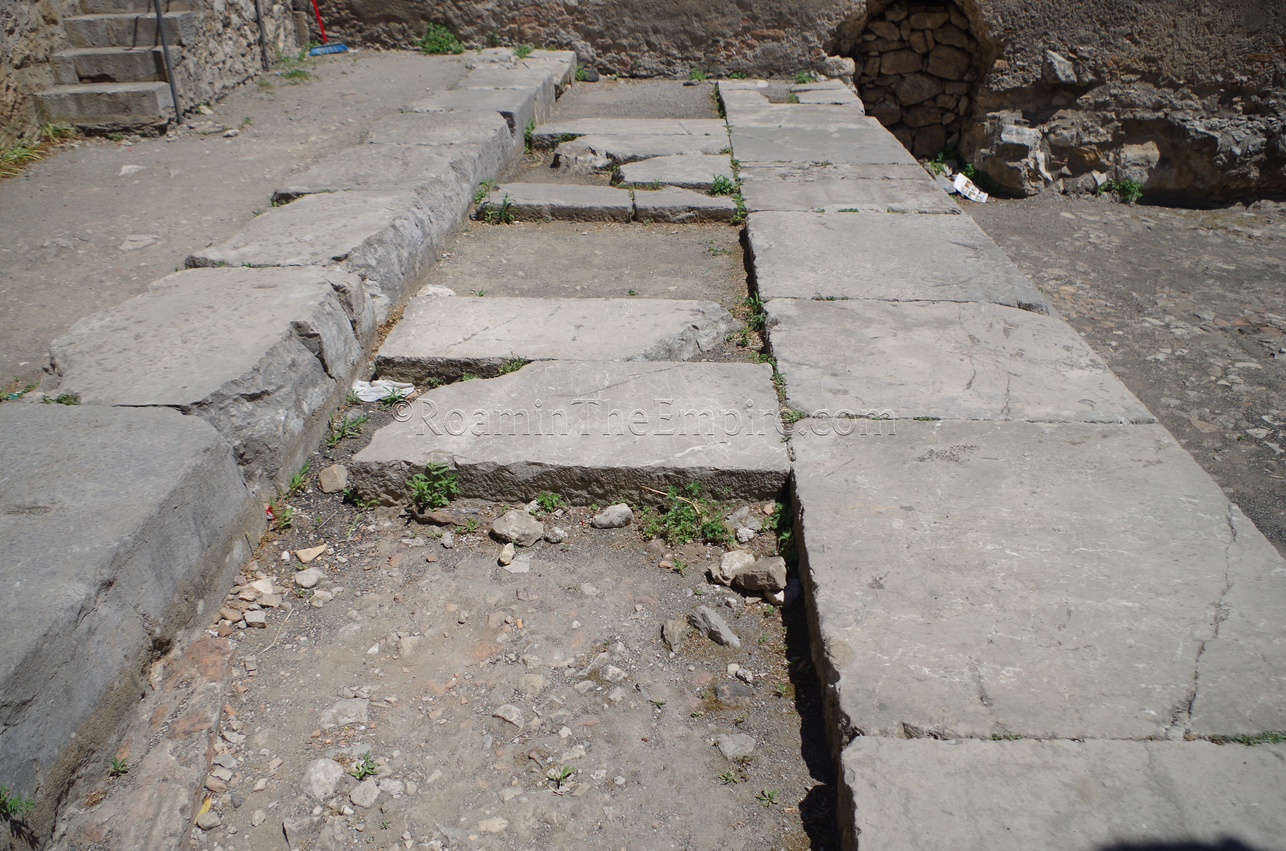 Steps of a 3rd century BCE temple on which the stage of the odeon of Tauromenium was constructed.