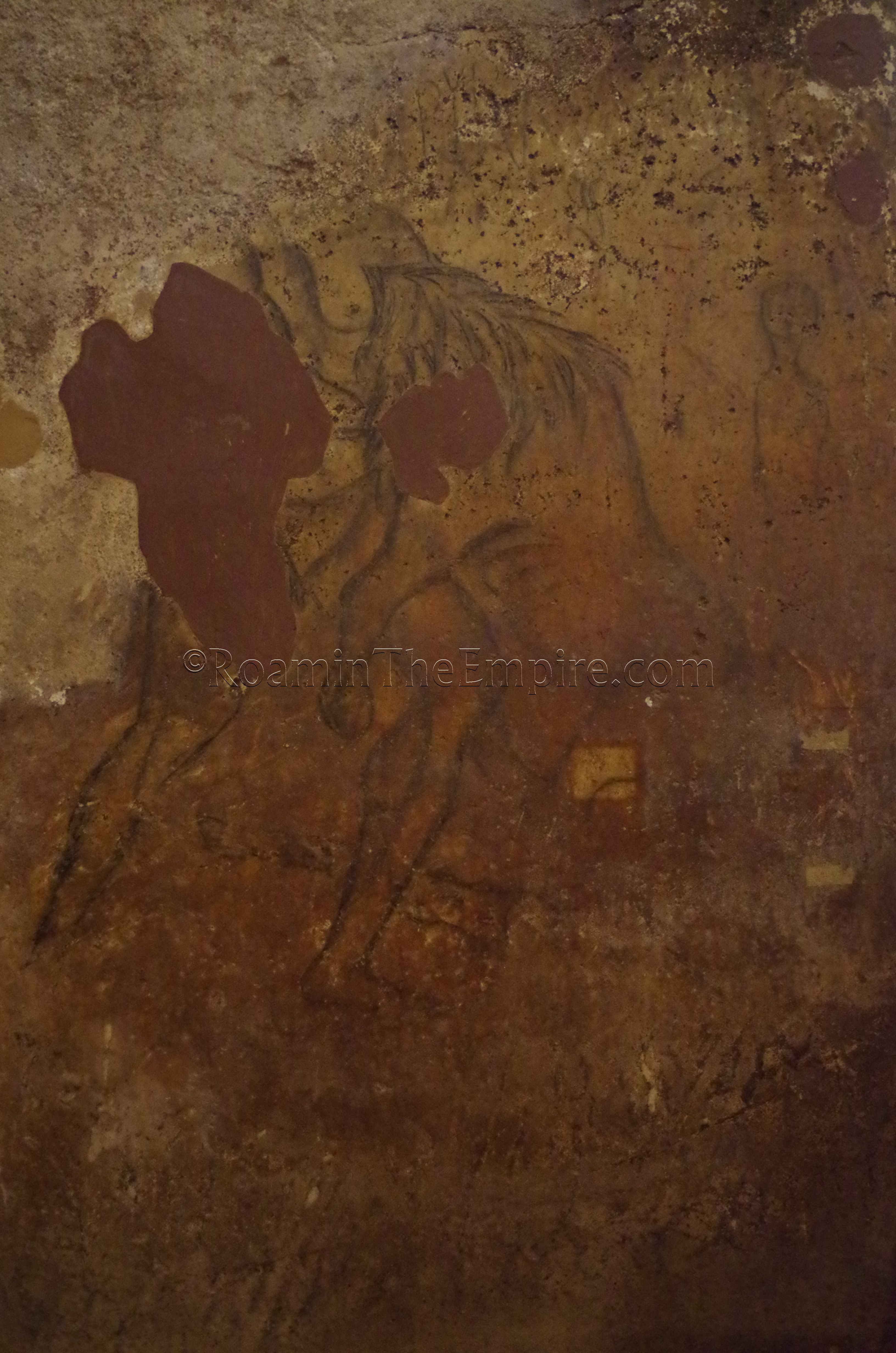Image of Hercules fighting the Nemean Lion in the hypogeum of the Chiesa di San Salvatore.