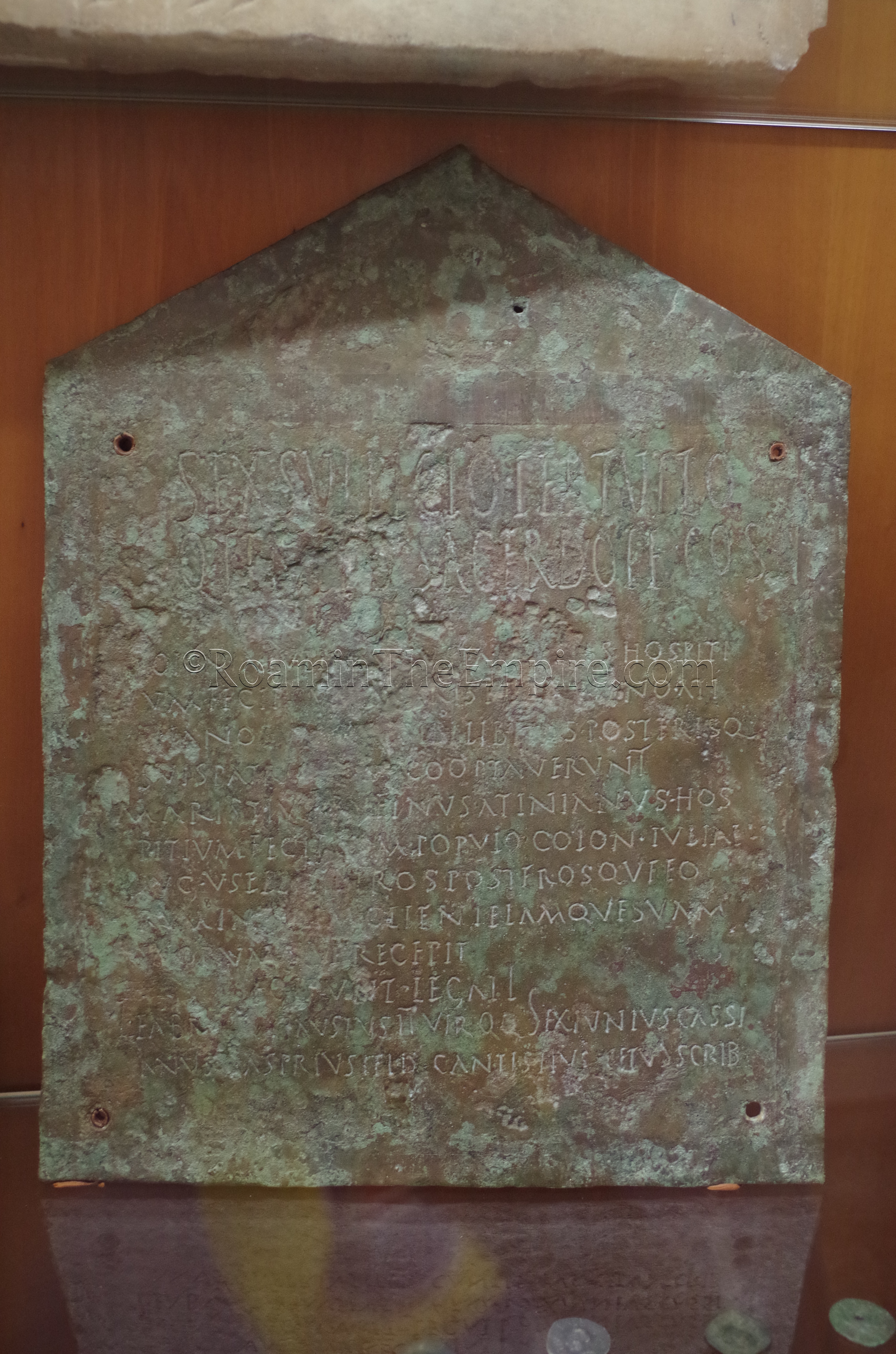 Bronze plaque noting a pact of hospitality between Colonia Augusta Julia Uselis and Marcus Aristius Balbinus Atinianus in 158 CE. Displayed in the Museo Archeologico e Storico Artistico 'Antiquarium Arborense.