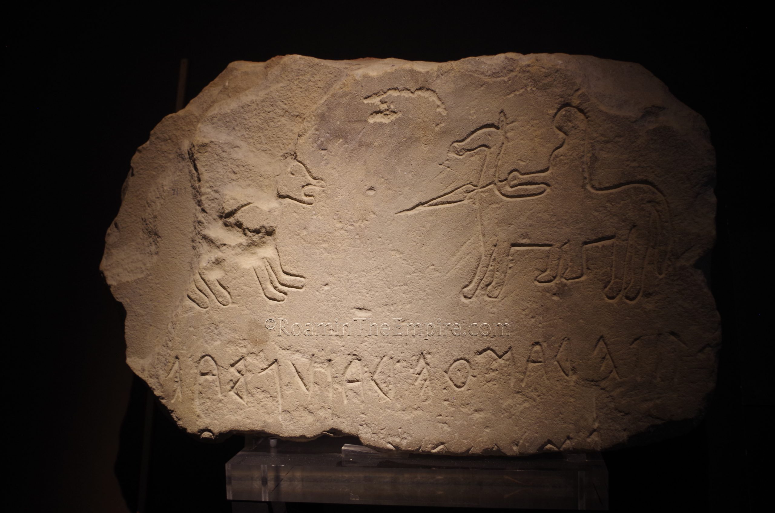 Picene stele with image of a hunter and untranslated text. From Novilara. Museo Archeologico Nazionale delle Marche.