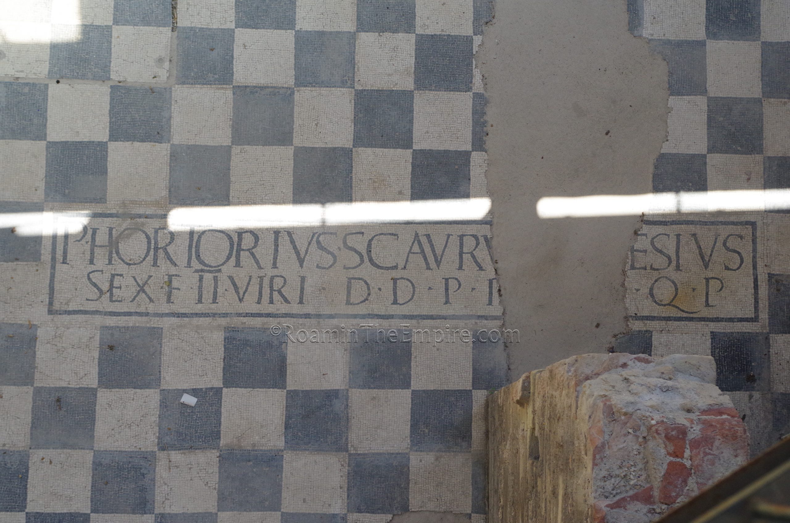 Mosaic inscription of Publius Hortorius Scaurus and Gaius Caesius at the ludus baths.