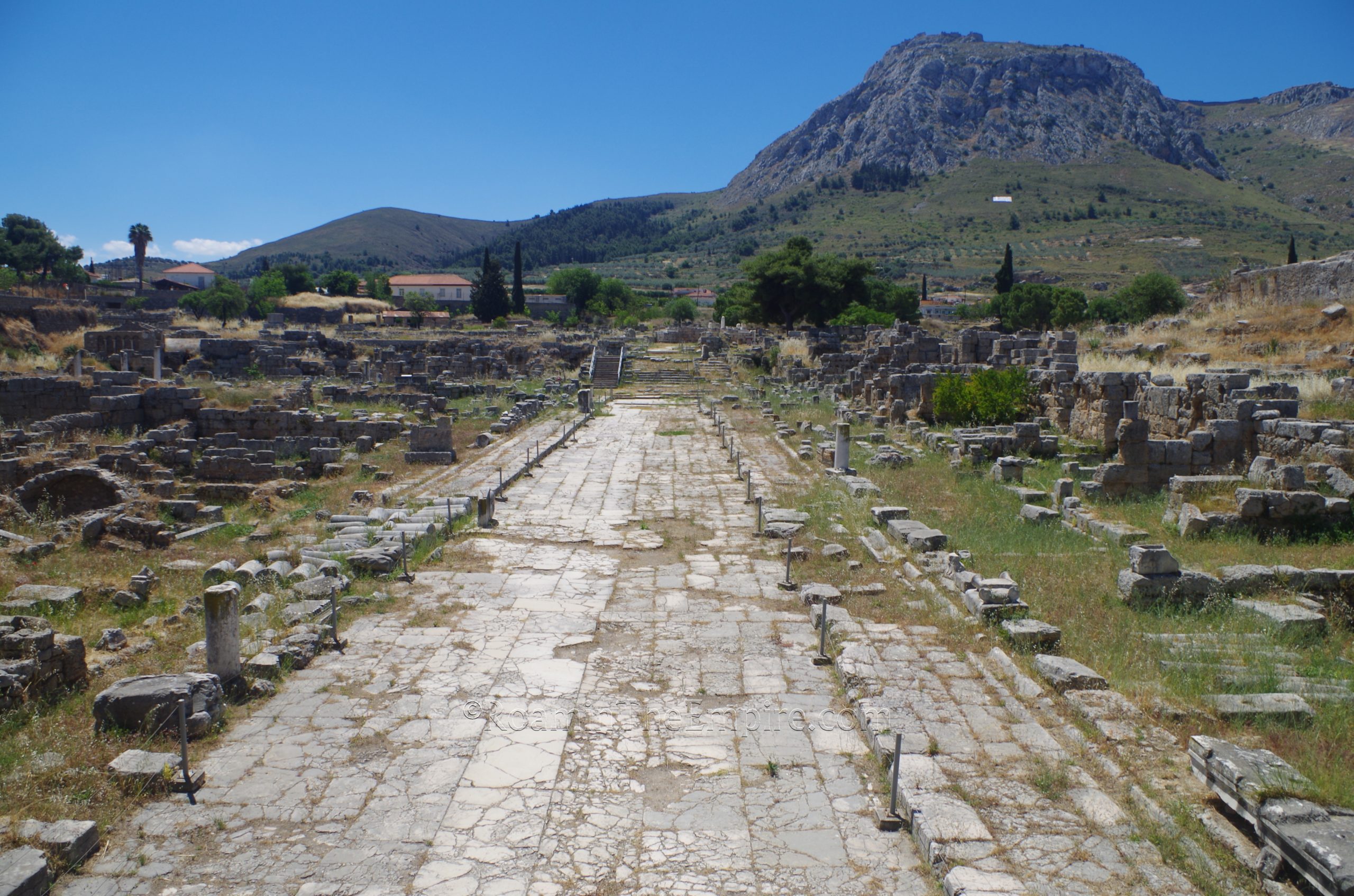 Lechaion Road from the north, Acrocorinth in the background. Corinth.