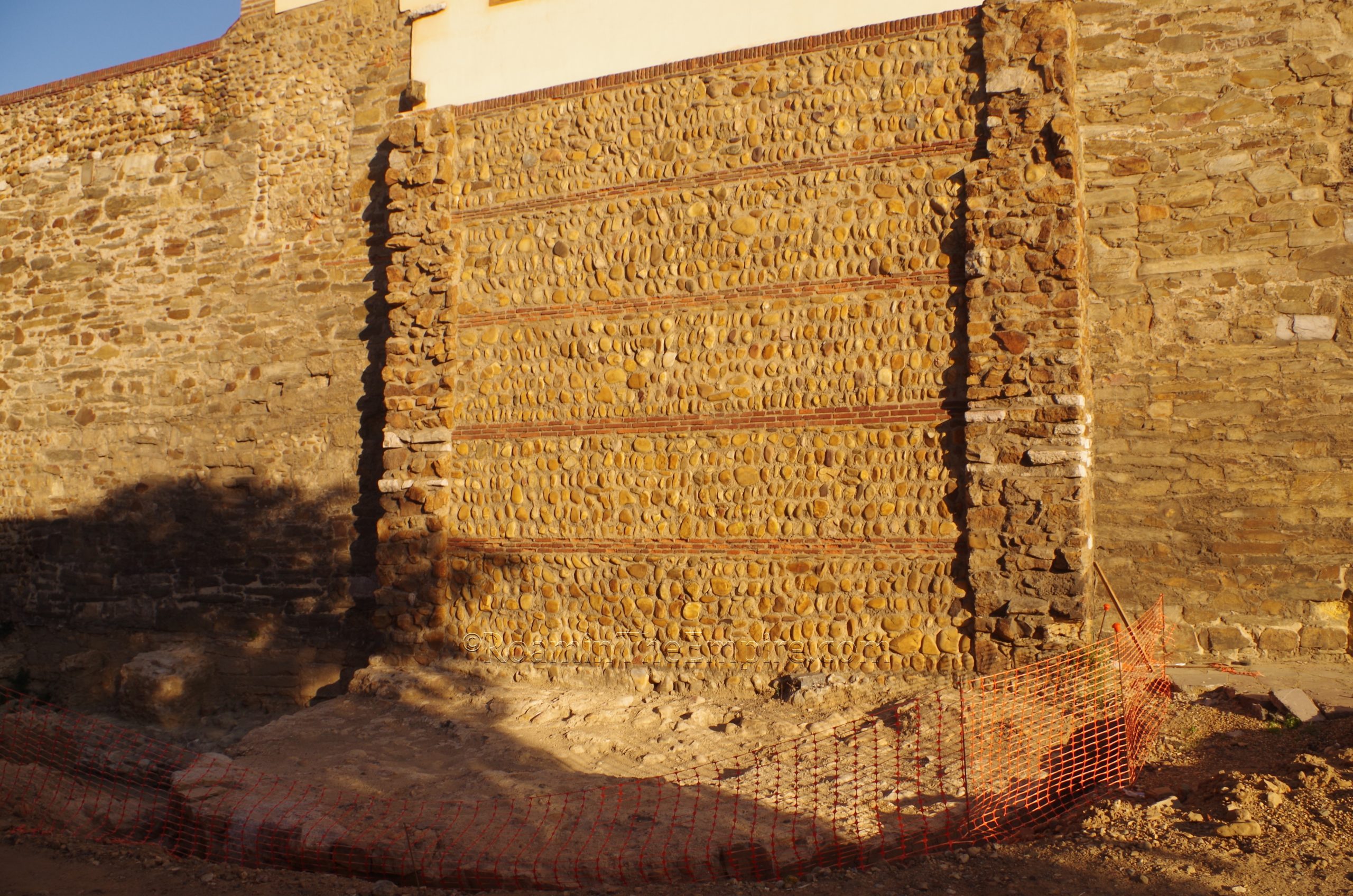 Wall and excavations of the demolished tower along Calle Carreras.