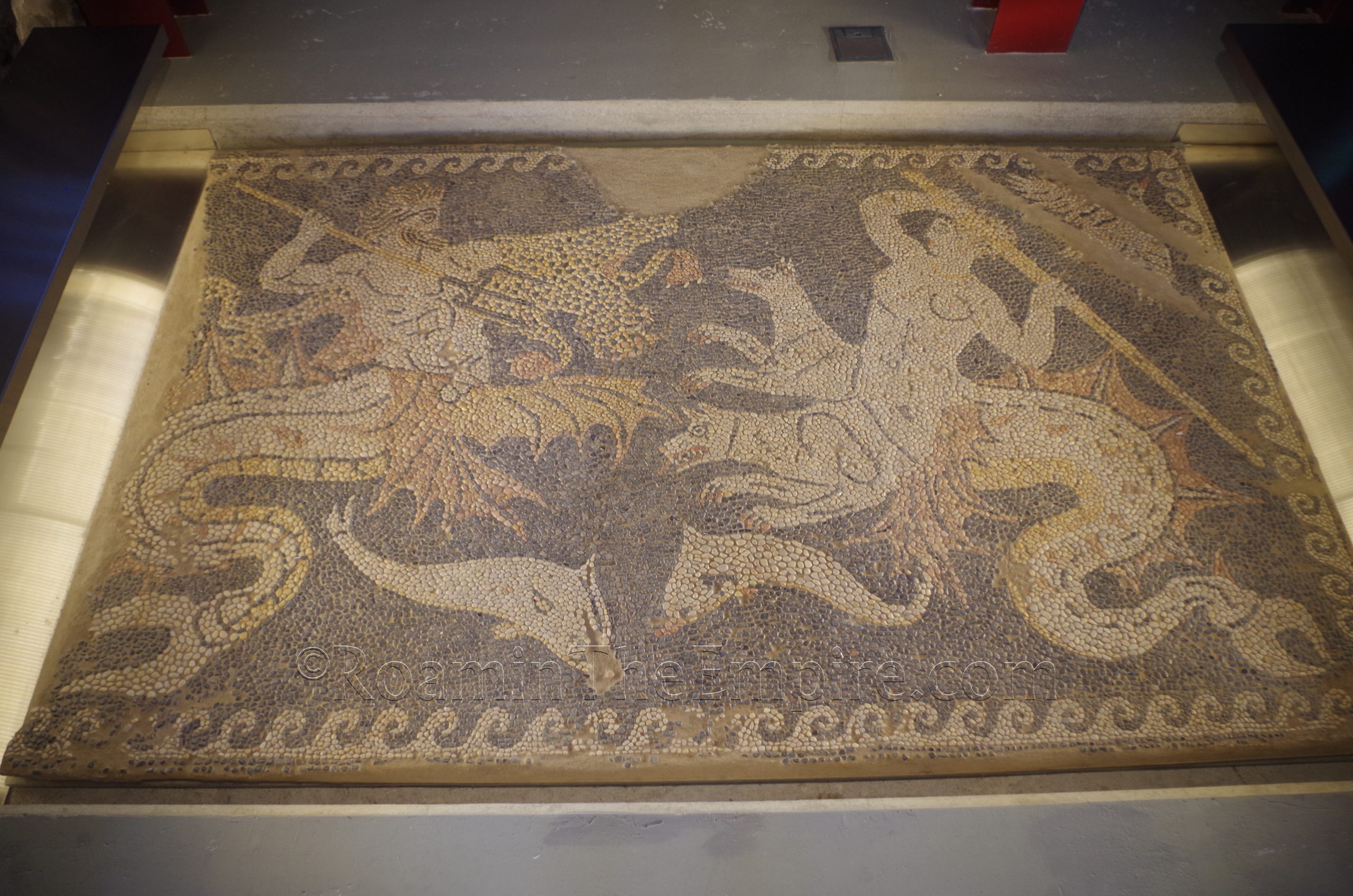Pebble mosaic floor depicting a Triton fighting with Scylla. Dated to the 4th century BCE and found in Eretria. New Archaeological Museum of Chalkis "Arethousa."