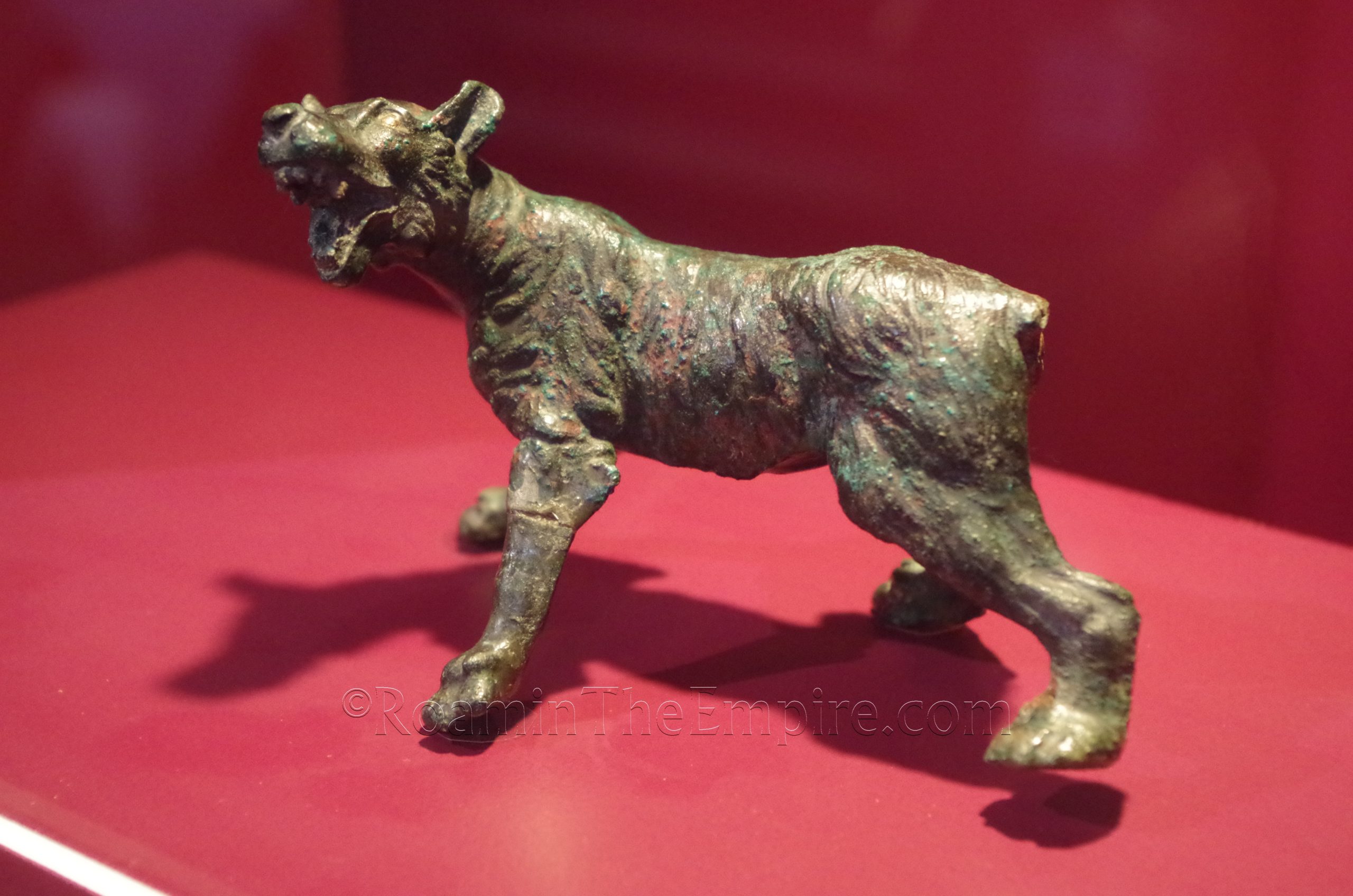 Bronze statuette of a dog or wolf with silver accents. Musée Archéologique de Bavay.