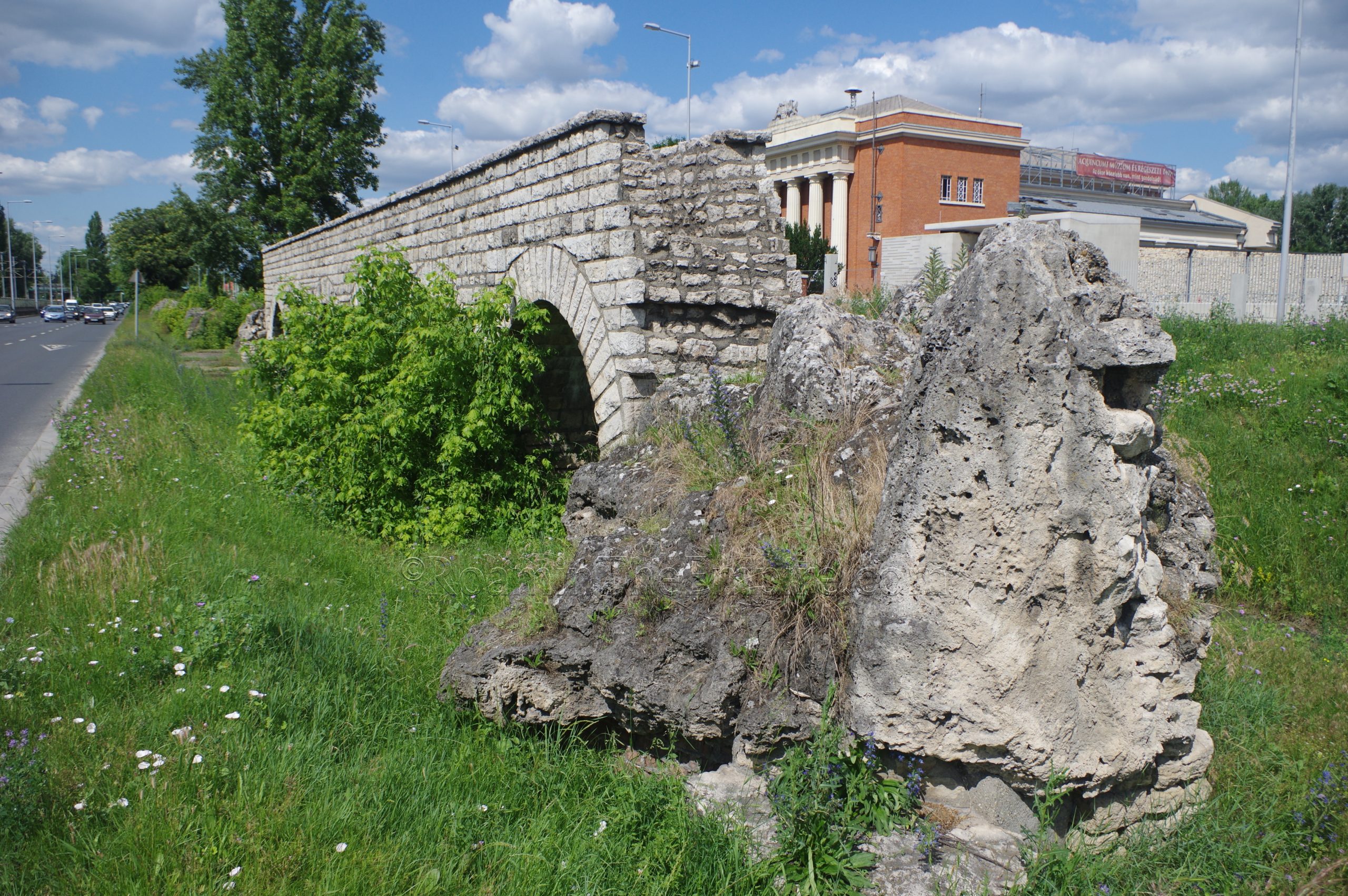 Remains and reconstruction of the aqueduct in the median of Szentendrei út near the Záhony utca intersection. Aquincum.