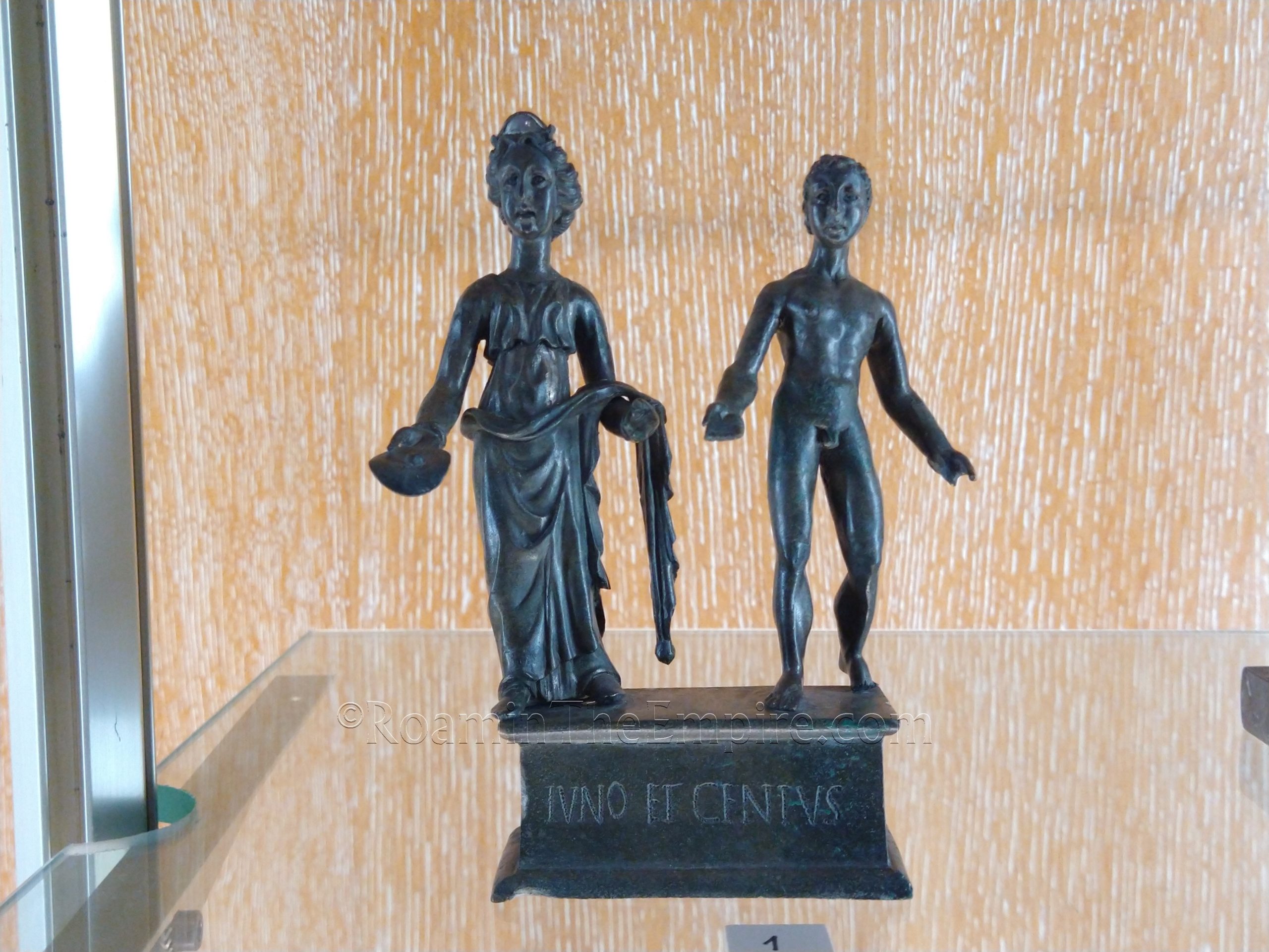 Bronze statuettes depicting Juno and a Genius. Dated to the 2nd century CE. From Mâlain. Musée Archéologique de Dijon.