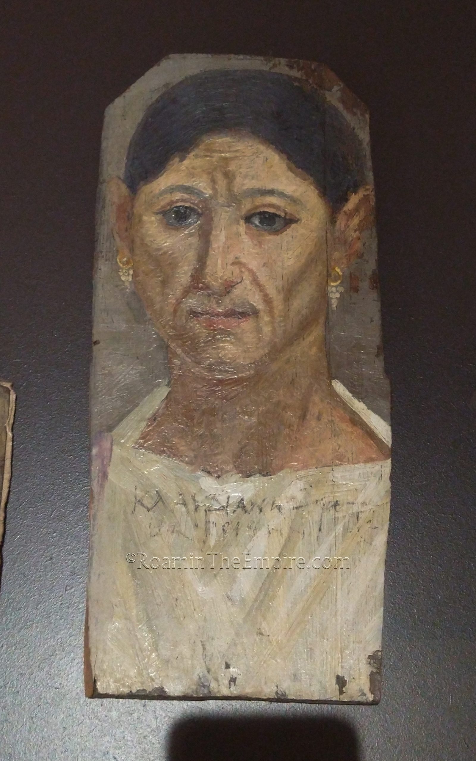 Mummy portrait with Greek inscription identifying the deceased as Claudiane, daughter of Phiobammon. Dated to 150-175 CE. From Antinoupolis. Musée des Beaux-Arts de Dijon.