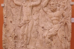 Relief from a funerary monument depicting Hercules and Hesione. From Dunapentele. Dated to the first half of the 3rd century CE.  Magyar Nemzeti Múzeum.
