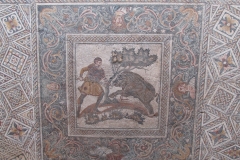 Mosaic depicting a wild boar hunt with the personification of the seasons surrounding. From the Las Tiendas Roman villa, dating to the 4th century CE.