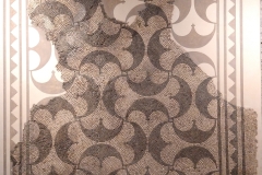 Geometric mosaic from an urban villa on display in the curia basement.