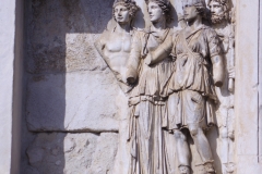 Detail from the Arch of Trajan of the left attic relief on the north side depicting Ceres, Diana, and Silvanus receiving Trajan.