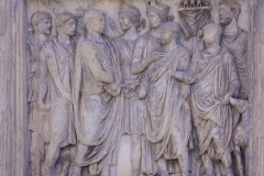 Detail from the Arch of Trajan of the upper left pier relief on the south side depicting the concession of lands to veterans in the Danube.