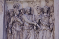 Detail from the Arch of Trajan of the left attic relief on the south side depicting the Capitoline gods receiving Trajan.