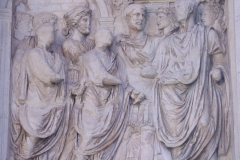 Detail from the Arch of Trajan of the right attic relief on the south side depicting Trajan and Hadrian being received by Rome.