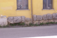 Remains of the Ponte Leproso in the wall of the adjacent building.