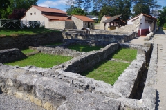 House III with House of the Cloth Merchant and House of the Oil Merchant reconstructions in the background.
