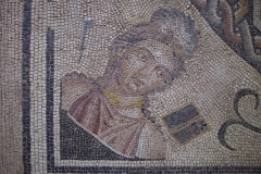 Fragment of a mosaic depicting the Muse Clio with a stylus and wax writing tablet. From the triclinium of the Casa de Orfeo. Dated to the 2nd century CE. Museo de Zaragoza.