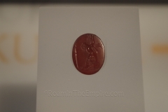 Carnelian intaglio depicting Cassandra grasping at the Trojan Palladium. Dated to the third quarter of the 1st century CE. From Xanten. LVR-RömerMuseum.