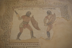 Detail of the mosaic from the House of the Gladiators depicting the gladiators Margareites and Hellenikos.