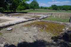 North wing of the Great Thermae, with replica statues of Asclepius' family found there.