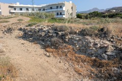 Wall from a harbor building adjacent to the Mavros  Molos.