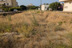 Residential area with decumanus in the foreground along Iroon Politechniou.