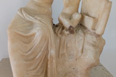 Statue group depicting Aphrodite and Eros seated on a rock. Dated to the latter half of the 1st century CE. Found at the House of Pheidias. Archaeological Museum of Kissamos.