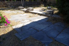 Pavement and column bases from the exedra on the west side of the propylon.