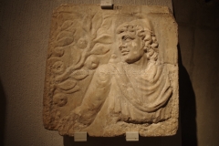 Relief of Mithras picking an apple. Found in Lyon and dated to the 2nd or 3rd century CE.