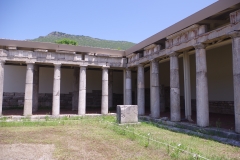 Northeast corner of the east stoa and stele for the Battle of Makistos.