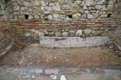 Marble revetment in a shop of the small baths.