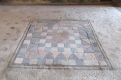 Opus sectile pavement (surrounded by opus scutulatum pavement) in the House of Paquius Proculus at Pompeii.