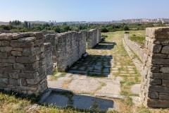 Covered portico running along the west side of the basilica urbana and southern basilica.