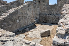 Room on the south side of the amphitheater used as a shrine to Nemesis and later a chapel .