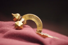 Reverse side of the gold fibula inscribed \'qu eannis. from the Museum of the City of Skopje.