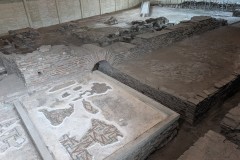 Room south of the apsidal hall bisected by a hypocaust channel.