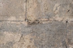 Mason marks on the north wall of hall 6a, east of the apse.